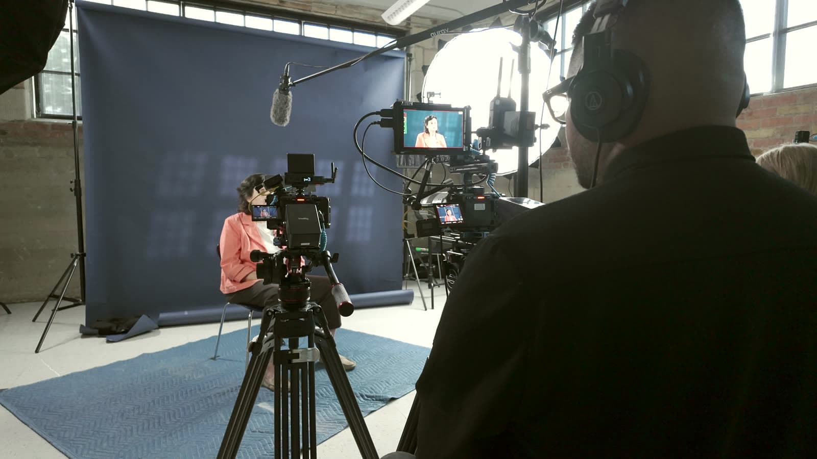 Griffith Media crew filming a Dallas College Foundation interview on a studio backdrop
