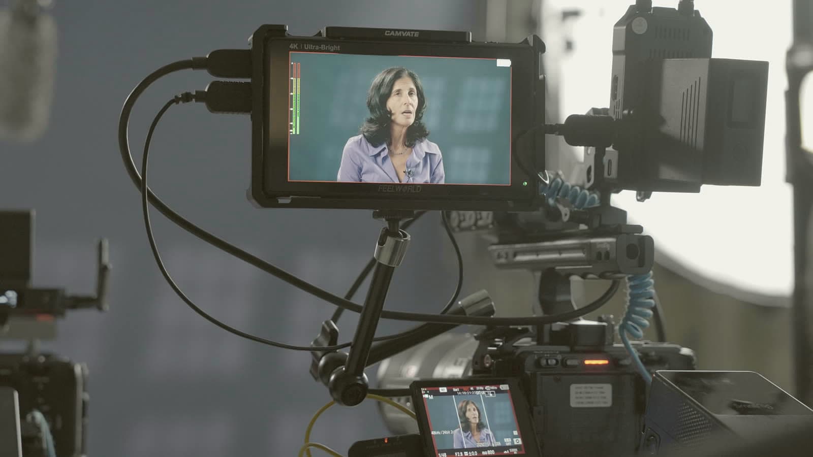 A camera monitor showing a Dallas College Foundation interview subject during the shoot