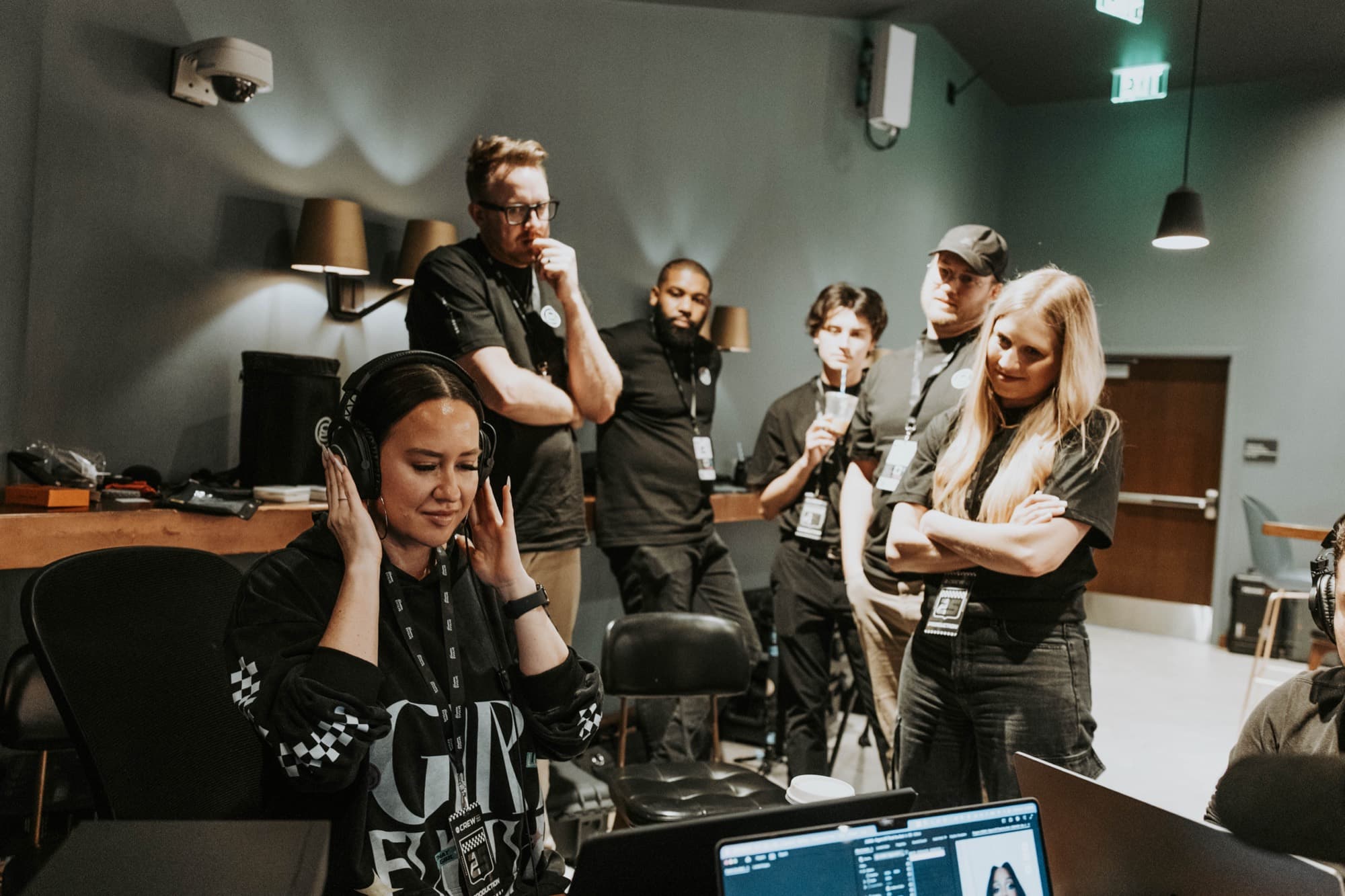 The team and client gathered around a laptop in the green room for the first watch-down of the recap