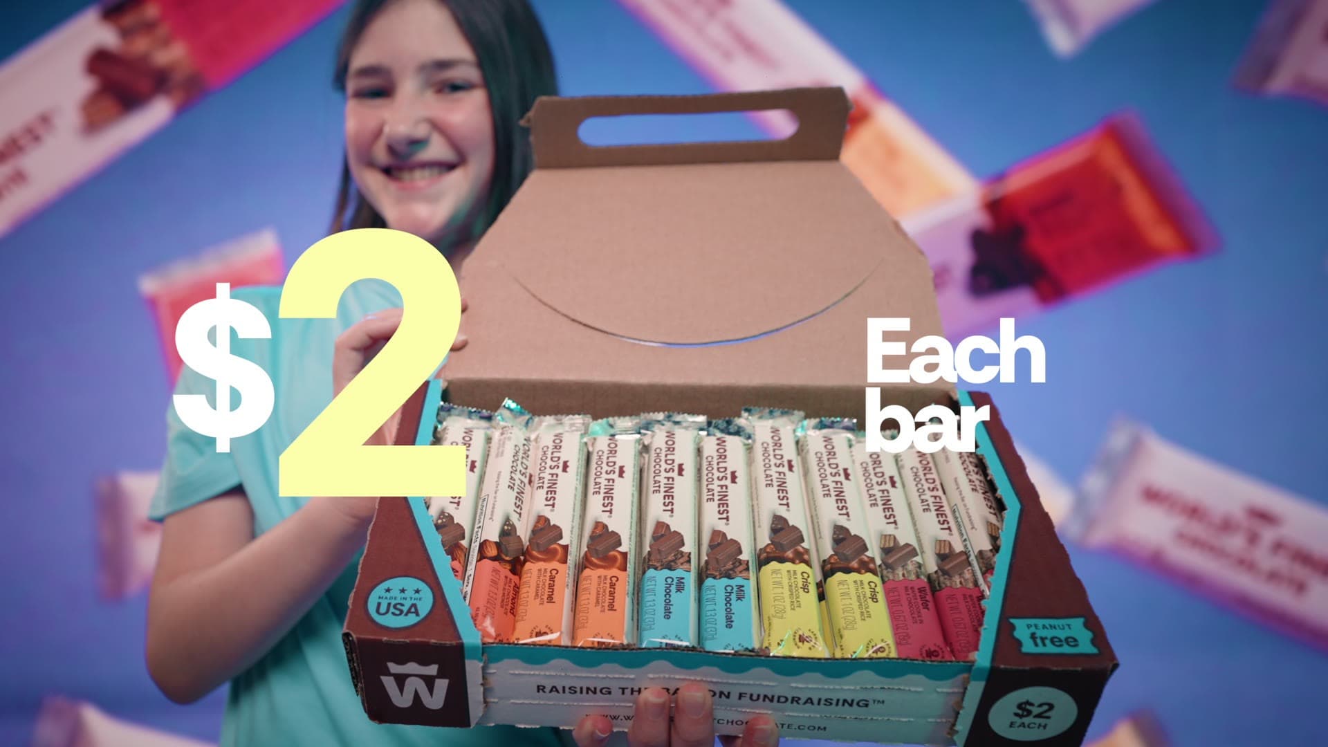 A World's Finest Chocolate fundraising box of bars held up to camera